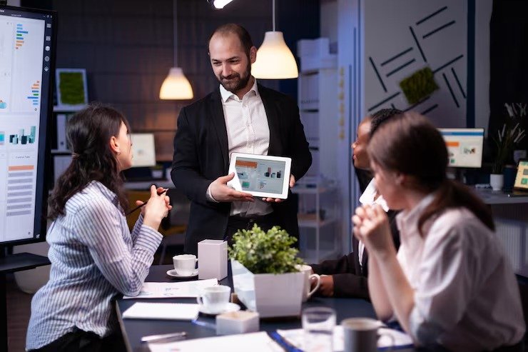 imgi_13_entrepreneur-businessman-showing-company-strategy-using-tablet-corporate-presentation_482257-10543